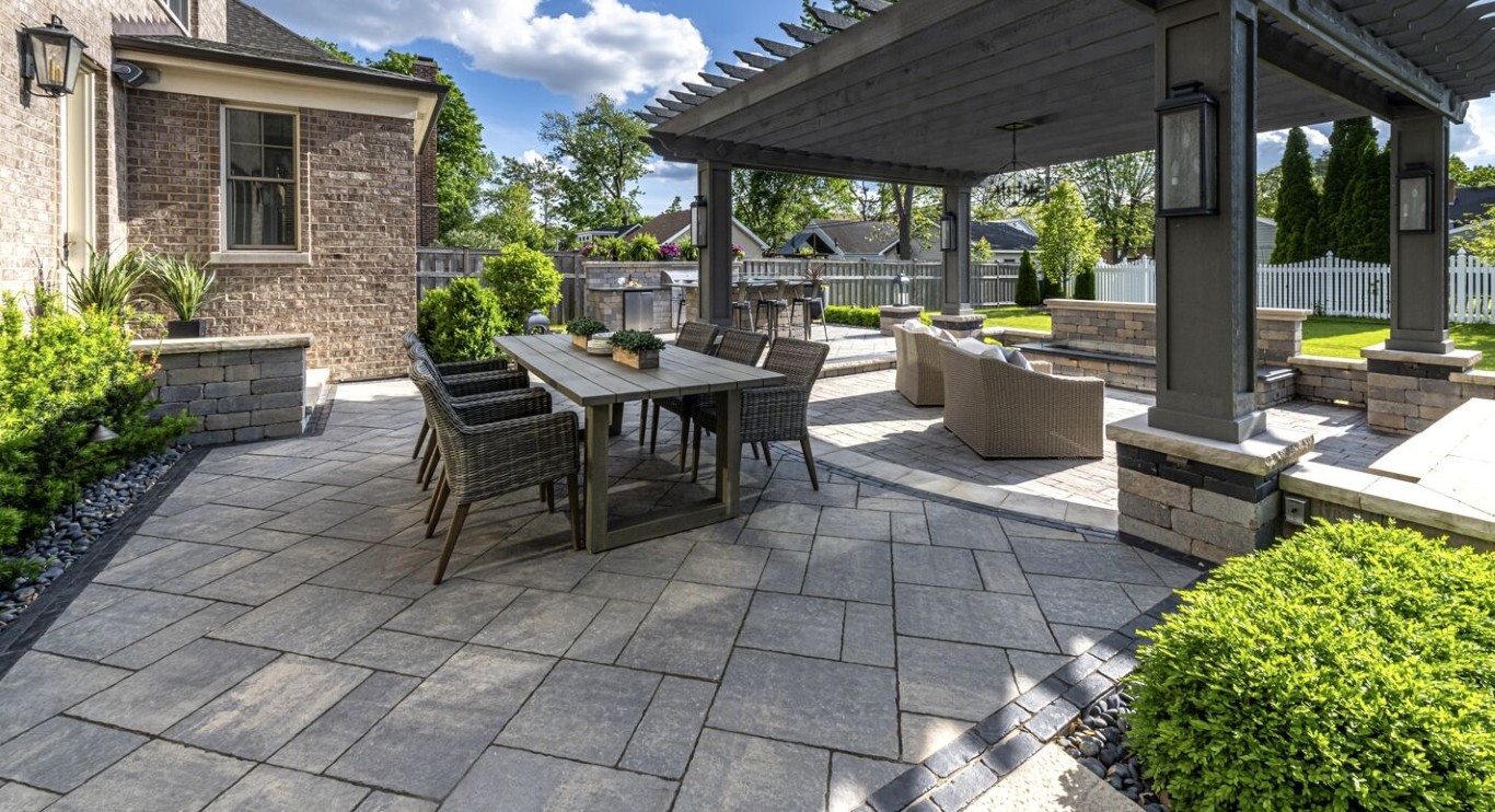 Outdoor patio with pergola hardscaping installation